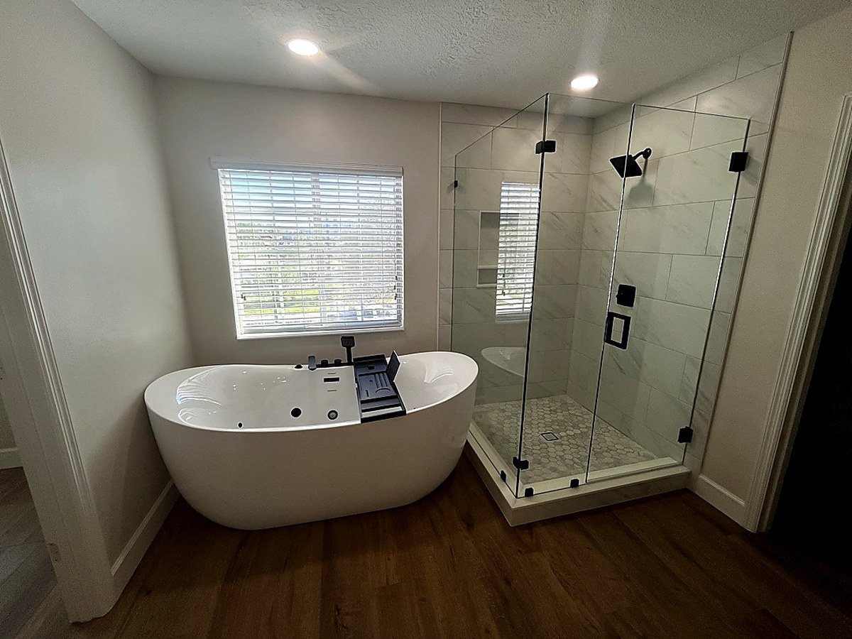 Custom bathroom remodel with large-format porcelain tile shower, KV Tileworks Central Florida
