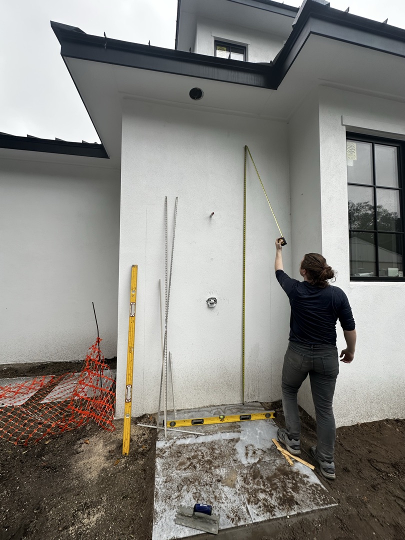 Measuring for exterior tile on new construction project, KV Tileworks